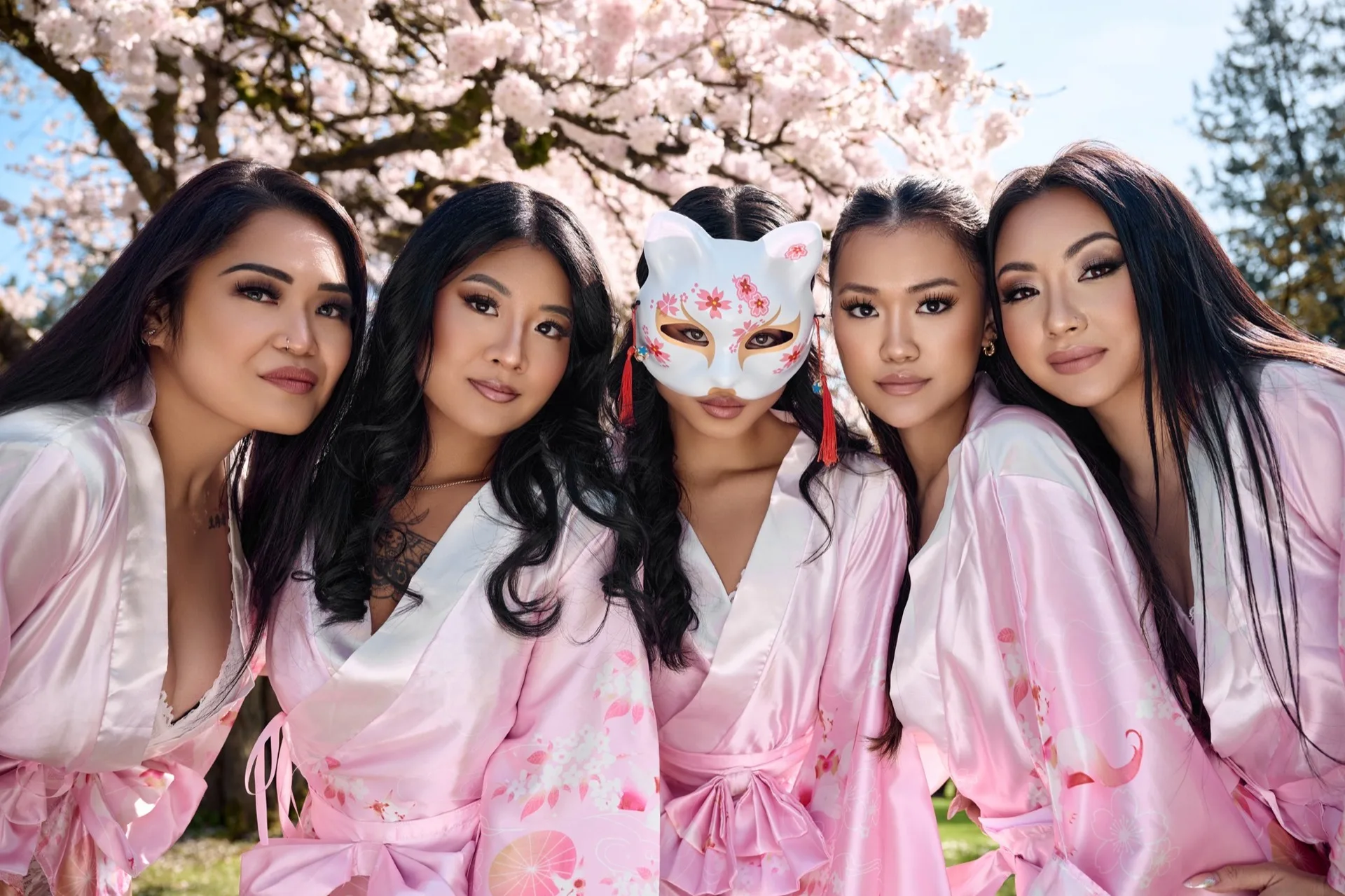 Elite Entertainment models beneath cherry blossoms